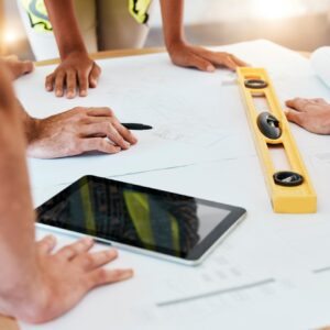 Architect, team or blueprint on paper, tablet or planning for construction, strategy and building d