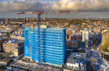 Construction crane building high rise apartment